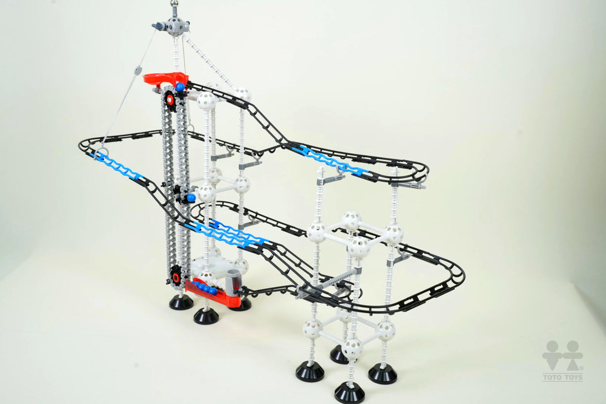 Odyssey Series marble coaster tower on a cream background with blue spiral tracks and colourful balls