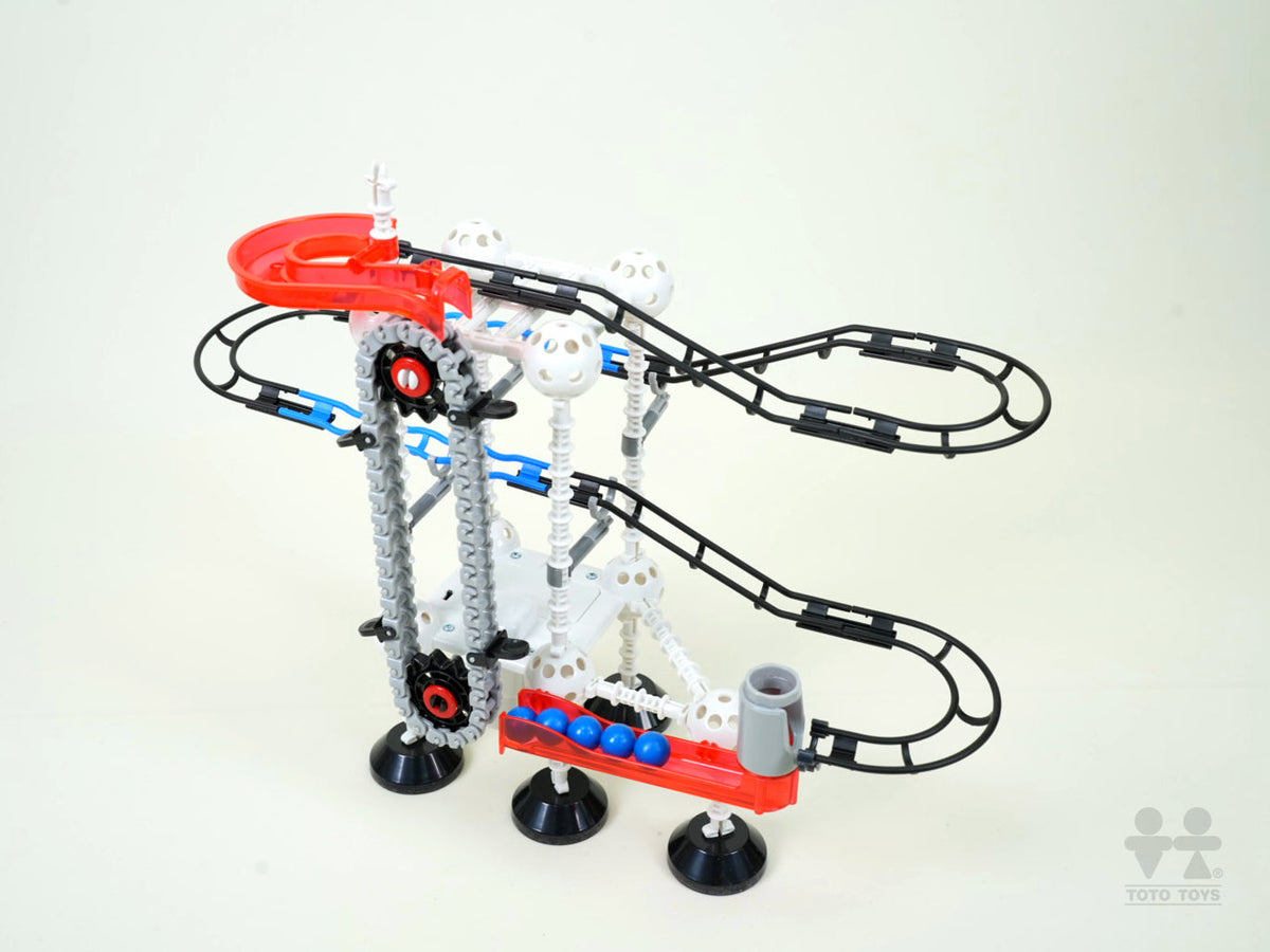 Odyssey electric lift marble track with red top funnel, blue bucket chain and grey ball joints on white