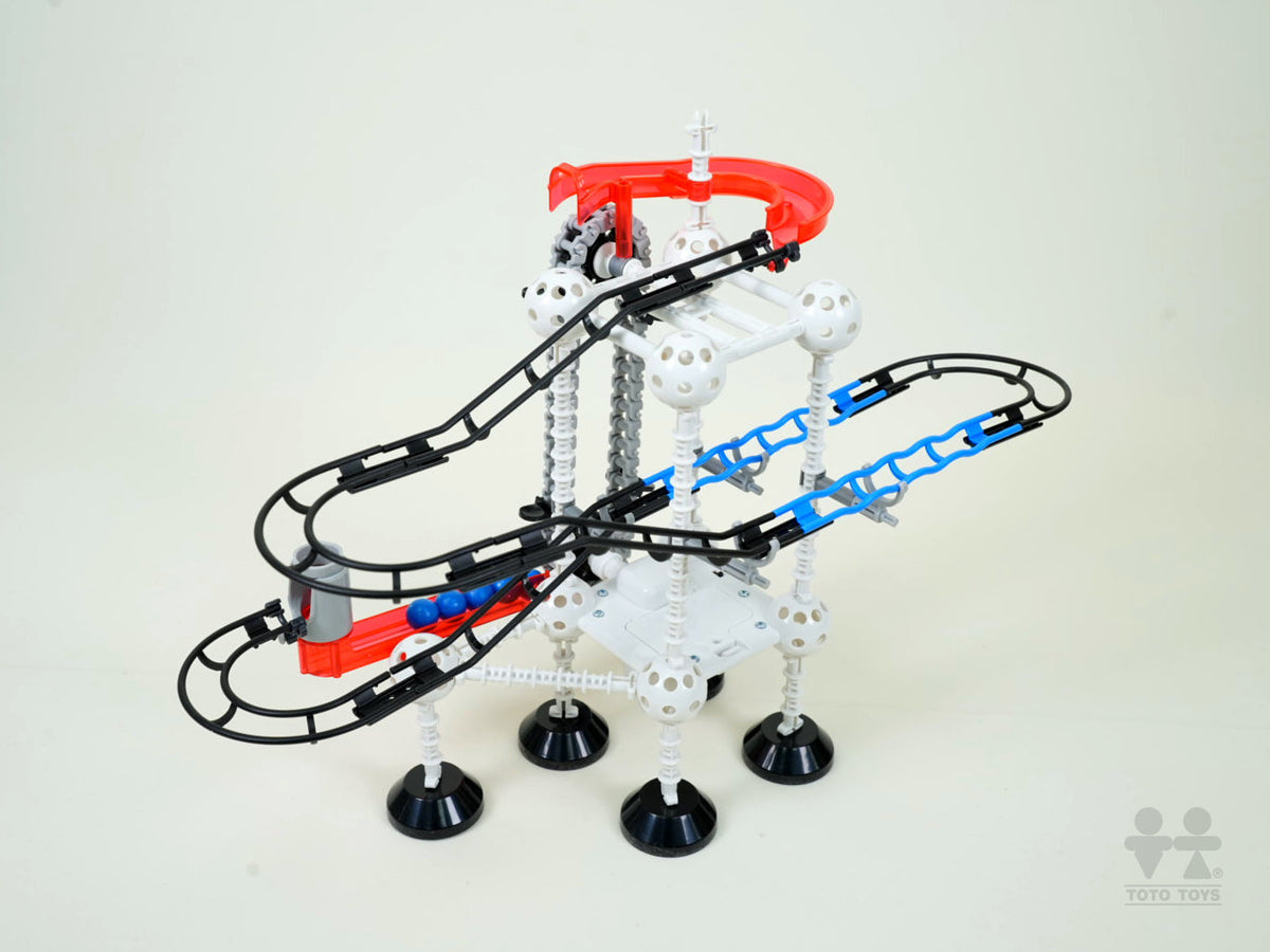 High-angle view of the Odyssey electric lift marble track showing its spiral lifter and coloured balls