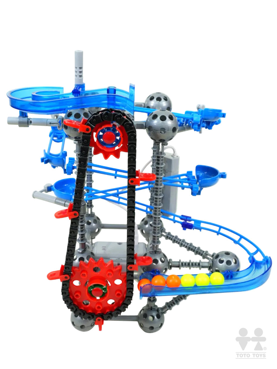 LoopTech marble run close-up: blue translucent frame, red sprocket, black chain and yellow balls