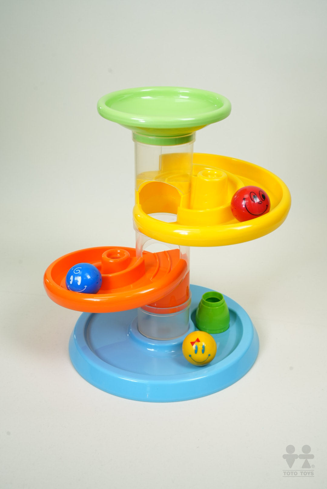 Close-up of the Rollipop toddler ball run with clear tube, stacked funnels and blue base on white