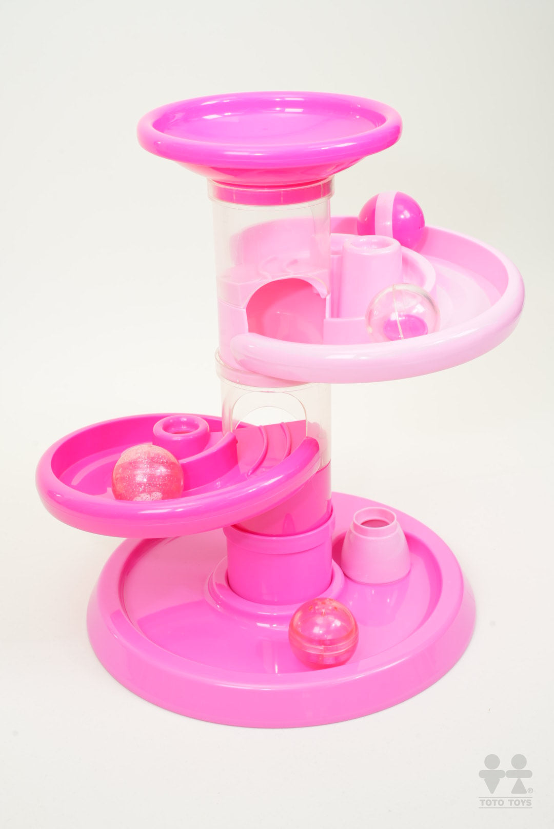 Pink Rollipop toddler ball run photographed on a pale grey background showing its three funnel levels
